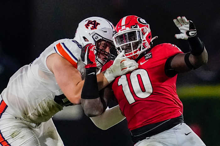 Oct 3, 2020; Athens, Georgia, USA; Auburn Tigers offensive lineman Austin Troxell (68) and Georgia Bulldogs defensive lineman Malik Herring (10) battle along the line during the second half at Sanford Stadium. Mandatory Credit: Dale Zanine-USA TODAY Sports